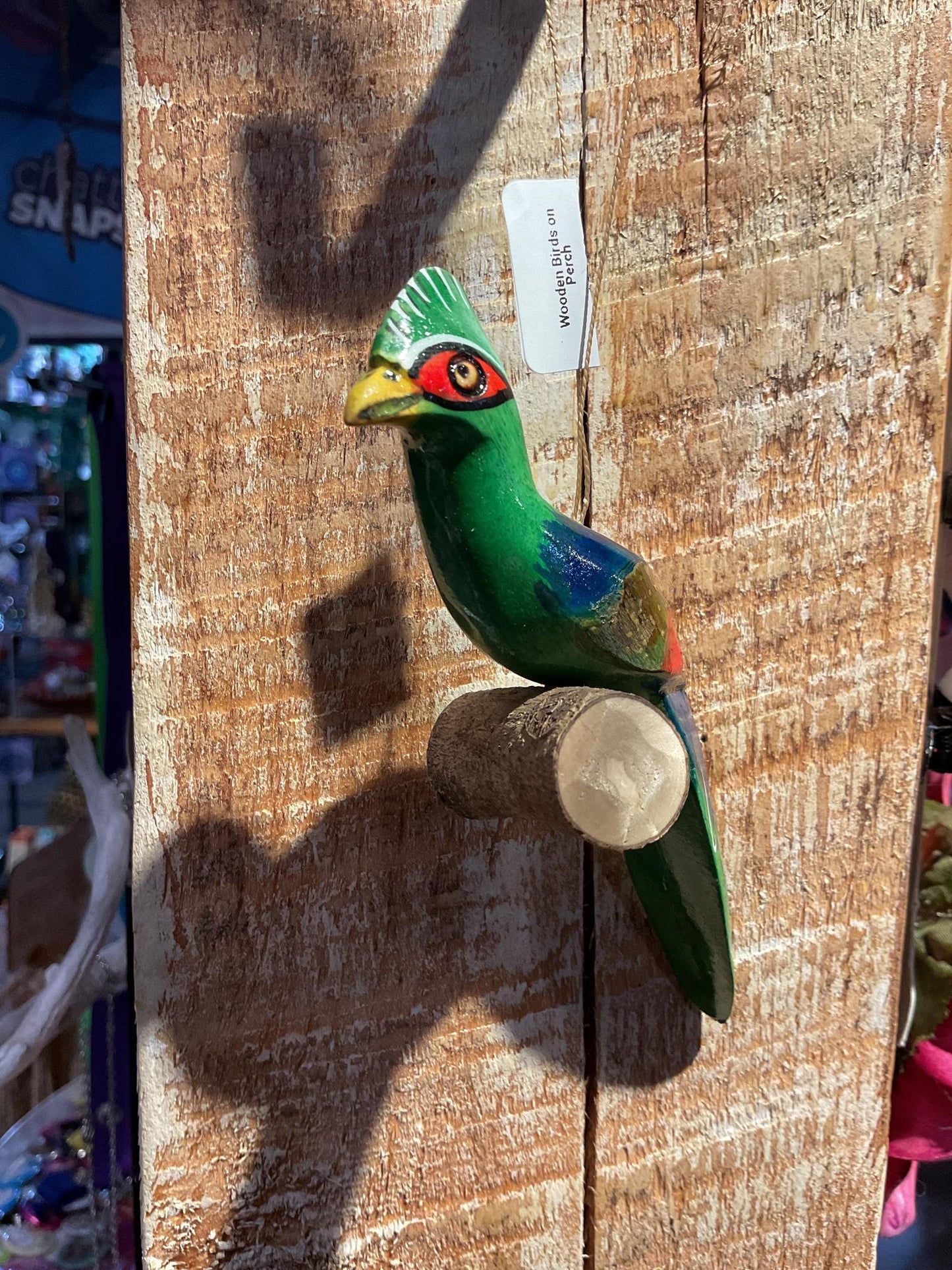 Wooden Birds on Perch